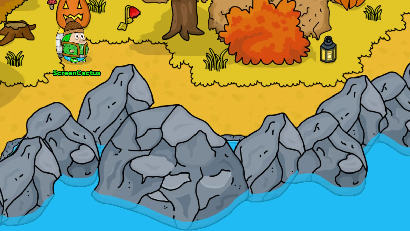 Big grey rocks along the edge of the Village pond, with the blue water lapping round their bottoms